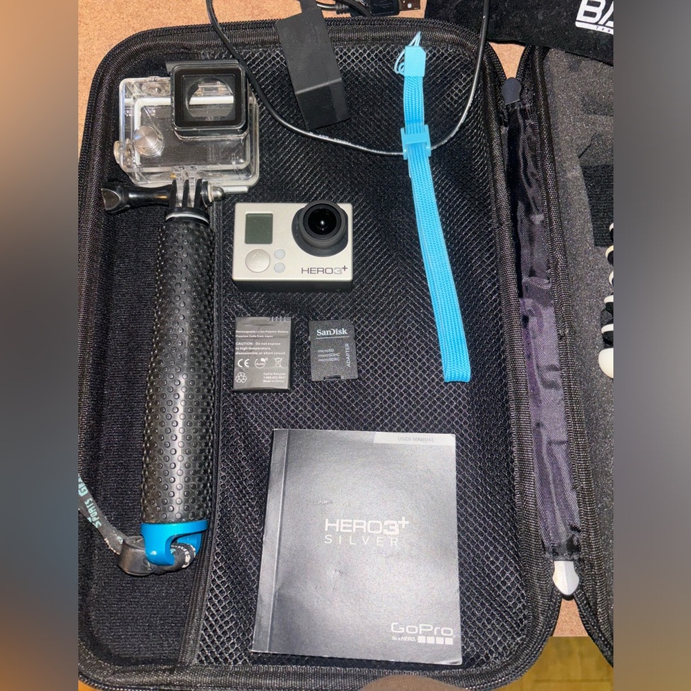 Grey GoPro Hero 3+ has 2 batterys & several stands with accessories . Very nice!